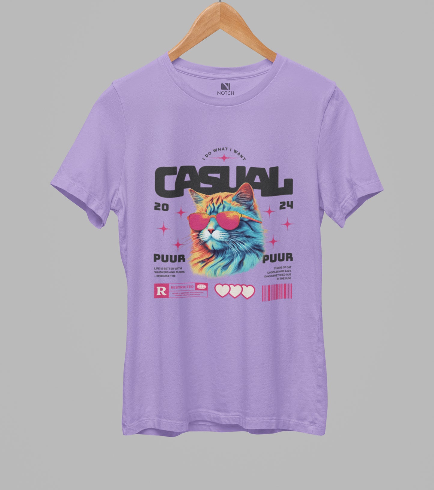 Purple t-shirt with a colorful cat graphic and text on a gray background
