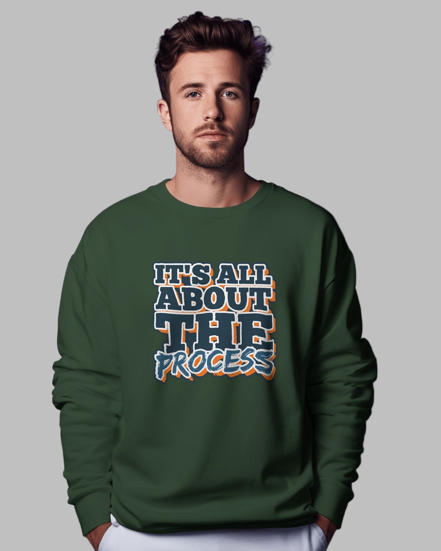 Man wearing a green sweatshirt with text on a purple background
