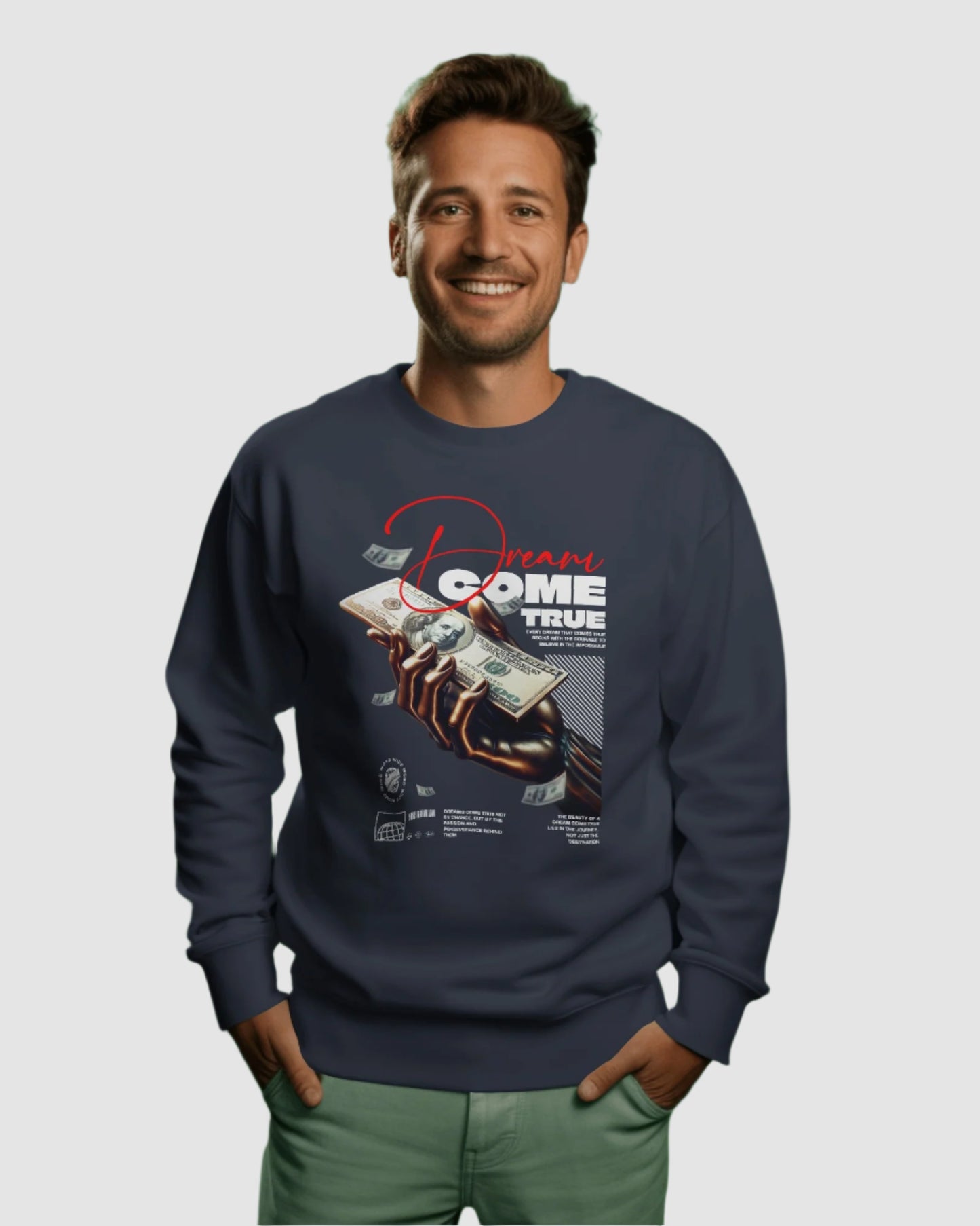 Man wearing a navy blue sweatshirt with graphic design on a green background