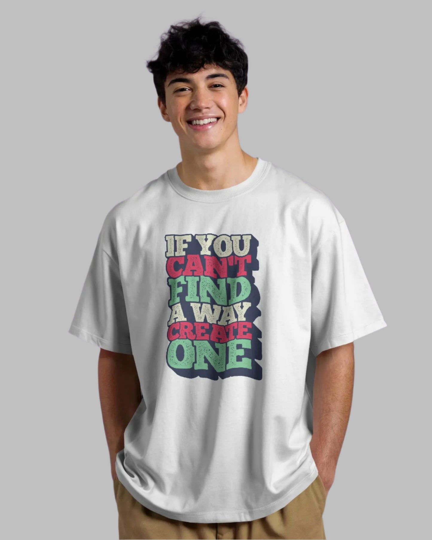 Person wearing a white t-shirt with colorful text on a purple background