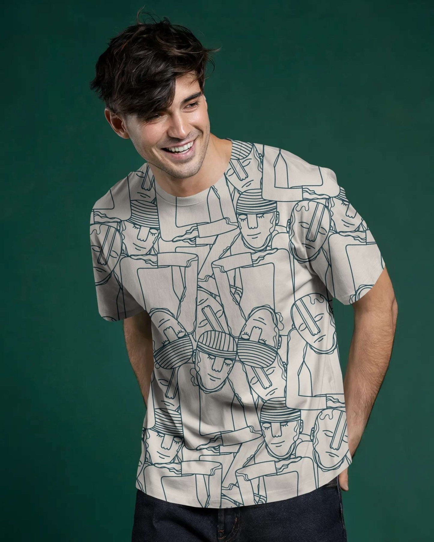 Man wearing a notch graphic t-shirt with abstract designs on a green background