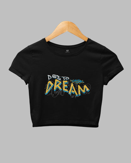 Black crop top with 'Dare to Dream' text on a hanger against a dark background