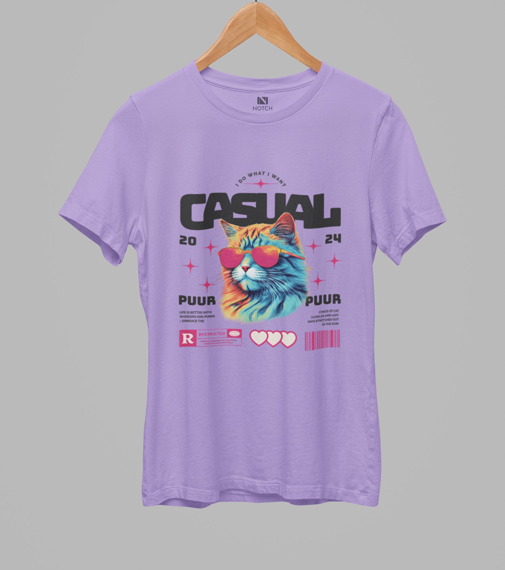 Purple t-shirt with a colorful cat graphic and text on a gray background