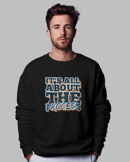 Man wearing a black sweatshirt with 'It's All About The Process' text against a purple background